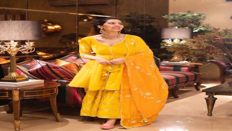 Indian women wearing yellow sharara suit set